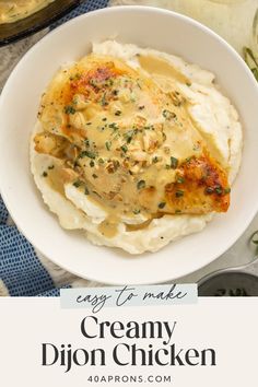 a white bowl filled with creamy chicken and mashed potatoes