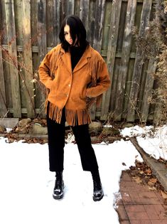 "Classic, carmel suede fringe jacket by Pioneer Wear, Made in USA. This 80s style has a slightly oversized padded shoulder and more fitted straight torso with semi raglan types sleeves (please see sleeve measurement specifics). Notched lapel. Soft and supple split cowhide suede leather. Fringe around yoke, and hem. 3 silver buttons up the front. Slide in pockets. Fully lined. Someone has added some plastic beads for a bit of color but you can remove them for a more classic cowgirl look. fits lik Suede Fringe Jacket Outfit, 70s Fringe Jacket, Bohemian Winter Leather Jacket With Fringe, Western Leather Jacket, Fringe Jacket Outfit, Sleeve Measurement, Black Suede Fringe Jacket, Classic Cowgirl, Fringed Jacket