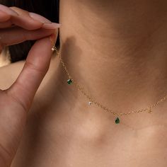 Feminine and minimalist, our vintage inspired Emerald Diamond Station Necklace is the perfect addition to any outfit. Whether you’re meeting friends for a spring picnic or traveling with your significant other, this dainty necklace can complement any personality ♡ Material: High Quality Solid 925 Sterling Silver Finish: Sterling Silver ∙ 18K Gold Featuring ~5.5mm Pear cut and ~5mm Princess cut CZ Emerald gemstones, and ~3mm Round CZ Diamonds dangling on an adjustable cable chain from 16 inches t Emerald Green Jewelry, Emerald Jewellery, Nose Pins, Teardrop Diamond, Spring Picnic, Princess Jewelry, Meeting Friends, Green Jewelry, Emerald Necklace