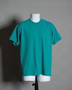 90s 00s plain tshirt in a turquoise blue color. GILDAN size - M vintage pre-owned cotton/polyester Turquoise Tshirt Outfit, Casual Turquoise Crew Neck T-shirt, 90s Green Cotton T-shirt, 90s Style Green Cotton T-shirt, Turquoise Cotton Crew Neck T-shirt, Turquoise Cotton Short Sleeve T-shirt, Turquoise Blue Outfit, Talk Poster, Turquoise Tshirt