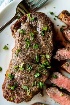 a plate with steak and potatoes on it