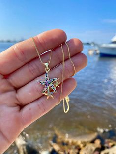 18K Gold Plated Box chain that is 18 inches long, has a lobster claw clasp and an extender ✨ The starfish pendant is also 18K gold plated with rainbow cubic zirconia details, measures 26 x 19 x 2mm🌊 Multicolor Starfish Necklace As Gift, Multicolor Starfish Charm Star Jewelry, Yellow Gold Star Necklaces With Starfish Charm, Dainty Star-shaped Necklace With Starfish Charm, Rainbow Star-shaped Jewelry With Star Charm, Ocean-inspired Starfish Charm Necklace For Gift, Summer Ocean-inspired Necklace With Starfish Charm, Elegant Star-shaped Necklace With Starfish Charm, Multicolor Star-shaped Jewelry With Starfish Charm