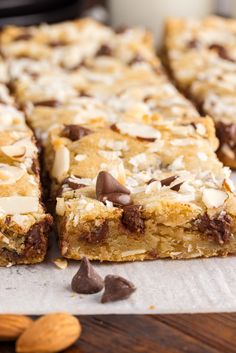 a close up of some food on a table with almonds and milk in the background