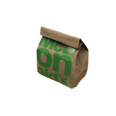 a brown paper bag with the words mcdonald's on it and green letters that spell out