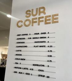 a sign that says sur coffee on the side of a wall in a store front