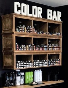 the color bar is on display with many bottles and containers in it's shelves