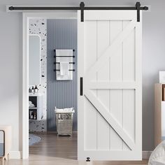 an open sliding barn door in a child's bedroom