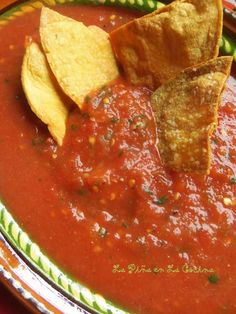 a bowl filled with salsa and tortilla chips