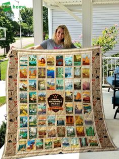 a woman holding up a large quilt with pictures on it and the words national park