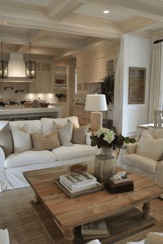 a living room filled with furniture and a wooden coffee table