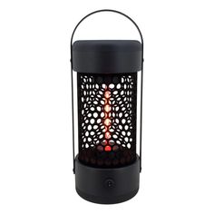 a black lantern with a red flame in the middle and circles on it's side