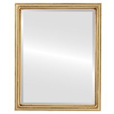 a gold framed mirror on a white background