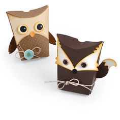 two brown and white boxes with owls on them, one is made out of paper