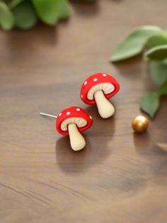 Description Add a touch of whimsy and madness to your style with these Mushroom earrings. Featuring cute mushroom designs, these earrings are perfect for adding a fun and quirky element to your look. Perfect for nature lovers and those who appreciate unique accessories. Details silver plated posts 1" colors: beige, red & white Features One of a kind, fashion jewelry, everyday jewelry Great gift for that special girl, anniversary gift, birthday gift or gift to say how much you care. Check out the Handmade Cute Mushroom Earrings, Cute Handmade Mushroom-shaped Earrings, Cute Handmade Mushroom Earrings, Whimsical Mushroom-shaped Earrings For Gifts, Cute Mushroom-shaped Earrings For Gifts, Fun Mushroom Design Jewelry For Gifts, Fun Mushroom Design Jewelry Gift, Cute White Earrings With Mushroom Design, Cute White Mushroom Design Earrings