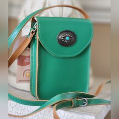 Unique Green Mw Most Wanted Crossbody Silver Metal Accent 100% Leather Gently Spot Clean With Water And Cloth Adjustable Shoulder Strap Measurements: 7"5"1.75" Great Gift Idea! Spoil Yourself And Shine Fashionable Statement To Your Fabulous Look Green Satchel Phone Bag For Everyday, Green Phone Bag As Gift, Green Satchel Shoulder Bag With Snap Closure, Green Bag With Cell Phone Pocket As Gift, Green Bag With Cell Phone Pocket For Gift, Green Satchel Phone Bag With Cell Phone Pocket, Turquoise Crossbody Bag With Adjustable Strap, Green Leather Bag With Snap Closure, Green Shoulder Bag With Snap Closure For Daily Use