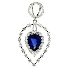 Step into sophistication with our exquisite pendant, expertly crafted from 18k white gold, weighing a graceful 3.08 grams. This contemporary piece boasts a chic and modern aesthetic, perfect for elevating any ensemble with its timeless charm. At its heart gleams a captivating pear-cut sapphire, weighing a luxurious 1.42 carats, radiating with deep, enchanting hues. Surrounding the majestic sapphire are 51 dazzling white round diamonds of 0.78 carats, meticulously set to enhance the pendant's allure and elegance. Each diamond sparkles with brilliance, adding a touch of glamour to the piece. The harmonious combination of the rich sapphire and the shimmering diamonds creates a mesmerizing contrast, making this pendant a standout accessory for any occasion. Embrace sophistication and style wit Sapphire Pendant, Modern Aesthetic, Pear Cut, Round Diamonds, Jewelry Necklace Pendant, Sapphire, Jewelry Necklaces, White Gold, Sparkle