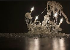 a crystal chandelier is lit up in the dark