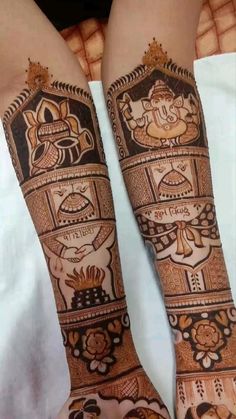 two hands with hendi designs on them