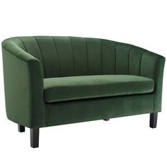 a green velvet chair with black legs