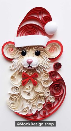 a paper cut rat with a santa hat on