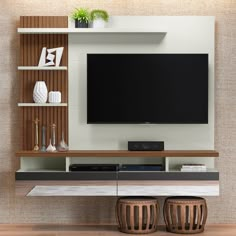 a flat screen tv sitting on top of a wooden entertainment center next to a wall mounted shelf