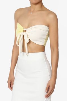 Embrace a playful yet chic vibe with our Colorblock Bow Knot Tie Front Bandeau.This eye-catching Strapless Crop Top features a bold colorblock design, accented with a charming bow knot for a touch of femininity.The ribbed texture adds a modern twist, making it perfect for pairing with over a tank top and high-rise jeans or flowy maxi skirts.Ideal for sunny days out or stylish evenings, it's a versatile addition to your wardrobe. Add this must-have top to your collection and turn heads with every stepColorblock design bandeau, ideal for summer parties or beach outgoingBow knot tie front detail, Double-lined front, No wireRibbed texture for a trendy look, perfect for high waisted jeans or skirtsStrapless style for a chic and stylish outfitModel size : 5'3" height, 33" bust, 24" waist, 34" hi White Bow Crop Top For Summer, Chic Multicolor Bandeau Tube Top, Summer Yellow Tops With Contrast Color, Yellow Summer Tops With Contrast Color, Yellow Tops With Contrast Color For Summer, Chic Multicolor Tube Top For Party, Chic Multicolor Bandeau Top, Chic Beach Tops With Bow Detail, Chic Multicolor Tube Top For Beach