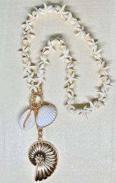 shell jewelry, shell necklace, shell jewelry, coastal necklace, coastal jewelry, vacation necklace, vacation jewelry. 18 inch toggle, genuine shell pendant necklace.  All jewelry purchases come beautifully gift wrapped at no additional cost. Complementary thank you goodie with each purchase as a token of our appreciation 1. Avoid Chemicals: Remove jewelry before using household cleaners, perfumes, or lotions. 2. Proper Storage: Store in a soft pouch or lined jewelry box to prevent scratches and Beach Shell Necklace Made Of Mother Of Pearl, White Starfish Charm Jewelry For Vacation, Ocean-inspired Shell Necklace With Lobster Clasp, White Jewelry With Starfish Charm For Vacation, Mother Of Pearl Shell-shaped Necklace For The Beach, Shell Jewelry With Lobster Clasp For Vacation, Adjustable Ocean-inspired Shell Necklace With Lobster Clasp, Beachy Shell-shaped Jewelry With Starfish Charm, Shell Necklace With Lobster Clasp