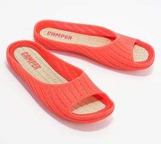 Sleek, simple, and oh-so-comfy, these slide sandals are ready for those relaxing evenings on the deck, hot summer days by the pool, and weekend trips to the beach. From Camper.\n\nOriginal item is A473218. This product may be a customer return, vendor sample, or on-air display and is not in its originally manufactured condition. It may not be new. In some instances, these items are repackaged by QVC. Summer Slip-on Sandals For Leisure, Red Beach Slides For Summer, Open Toe Flip Flops For Beach Season Leisure, Red Slides For Beach And Summer, Red Slides For Beach In Summer, Open Toe Slides For Beach Season And Outdoor, Open Toe Slides For Outdoor Beach Season, Open Toe Slides For Beach Season, Outdoor Summer Slides For Spring