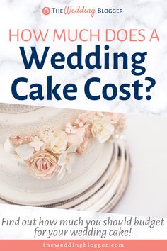 a wedding cake with flowers on top and the words how much does a wedding cake cost?