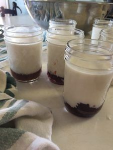 several jars filled with food sitting on top of a table