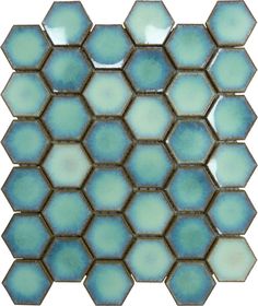 a blue and white mosaic tile with hexagonal tiles in the middle, on a white background