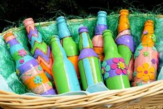 a basket filled with lots of colorful bottles