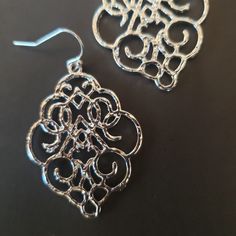 Light weight Moroccan Style Filigree Dangle Drop Earrings in your choice of Silver or Gold. In the theme of Scheherazade and the Arabian nights, these Arabesque, Moroccan style Filigree earrings are very lightweight but heavy in shine and beauty. These are a great day into night/casual to formal accessory... a must for any jewelry collection.Details: Earwire: Sterling Silver/24KGFThese earrings come in a beautiful organza bag and gift box and are ready for gift giving. You will receive the exact Elegant Metal Hoop Earrings With Filigree, Silver Metal Chandelier Earrings With Filigree, Silver Intricate Chandelier Drop Earrings, Silver Chandelier Earrings With Intricate Design, Silver Chandelier Drop Earrings With Intricate Design, Filigree Metal Earrings For Party, Metal Filigree Earrings For Party, Ornate Metal Teardrop Earrings, Elegant Metal Plug Earrings With Intricate Design