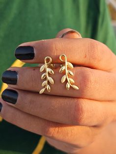 Leaf Branch Stud Earrings, Minimalist Leaf Earrings, 14K Gold Leaf Stud Earrings, Olive Branch Leaf Earrings,Solid Gold Leaf Branch Earrings ♠  Details Earring Size: 9 X 20.50 ➵  Metal Change(10k/14k/18k White/Yellow/Rose Gold) ➵  Stamp/Hallmark: Yes  ➵  Handmade item A classic and elegant choice of stud Earrings. You are the most shinning star when wearing them! Just feel the sparkle from it. Anniversary gift for her, bridal stud earrings, stud earrings, wedding stud earrings, gift for mum, Christmas gift, Valentine's gift for her, Valentine's gift for him, gemstone earrings, gemstone jewelry I accept custom making order. please  contact  me if you need this service. All the jewelry in my store is handmade .it may take 2-3 weeks  to finish.  ♠ Buy with Warranty:       ➵14 Days Money Back Affordable Green Leaf-shaped Jewelry, Gold Ear Climbers As Gift, Handmade Gold Ear Climbers As Gift, Handmade Gold Ear Climbers Gift, Handmade Gold Ear Climbers For Gift, Gold Ear Climbers Gift, Leaf Earrings Gold, Bridal Earrings Studs, Wedding Studs