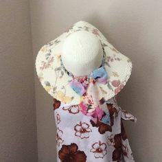 Very Cute And Stylish Hat Just In Time For Summer With A Lace To Make It Into A Bow Floral Print Sun Hat For Summer, Summer Floral Print Sun Hat For Vacation, Adjustable Floral Print Sun Hat For The Beach, Adjustable Floral Print Sun Hat For Beach, Spring Beach Sun Hat With Floral Print, Summer Brimmed Sun Hat With Bow, White Floral Print Beach Hat, Adjustable Flower-shaped Sun Hat For Vacation, Casual Flower-shaped Sun Hat For Summer