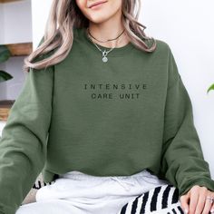 Embrace comfort and style with our Intensive Care Unit Sweatshirt--a perfect blend of coziness and statement design. Whether you're an ICU worker, a healthcare hero, or simply a fan of unique apparel, this sweatshirt brings warmth and inspiration to your wardrobe. ✨ Soft & Cozy: Crafted from premium, breathable fabric, it's your go-to for cool mornings and relaxed evenings. ✨ Unique Design: Featuring a minimalist ICU-themed design, it's made for those who appreciate subtle yet meaningful fashion. ✨ Made for You: Every sweatshirt is made to order, ensuring each piece is tailored with care and quality. Why You Love It: Unmatched Comfort: Soft, plush material that feels great all day long. High-Quality Prints: Durable design that stays vibrant even after multiple washes. Perfect Fit: Customer Casual Long Sleeve Nursing Tops, Cotton Relaxed Fit Nursing Sweatshirt, Cotton Nursing-friendly Relaxed Fit Sweatshirt, Casual Cotton Sweatshirt For Nursing, Casual Nursing Top With Crew Neck, Relaxed Fit Nursing Tops With Crew Neck, Casual Nursing Tops With Relaxed Fit, Gift For Nurse, Intensive Care Unit