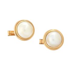 These cufflinks are imbued with an undeniable sense of old Hollywood luxury. With their vintage-inspired thick 18K Yellow Gold borders, these Pearl cufflinks are equally elegant on during an evening out or for the superior suited daywear style. Handmade with 18K Yellow Gold Featuring Genuine Pearls hand-selected for shape and color Packaged in a black wood lacquered box, perfect for gifting, storage, and display use Matching tuxedo studs are available. Elegant White Gold Cufflinks For Anniversary, Classic Gold Jewelry For Formal Occasions, Classic Round Cufflinks For Business, Elegant White Gold Cufflinks With Polished Finish, Luxury Cufflinks For Formal Occasions, Elegant White Gold Cufflinks For Business, Luxury Formal Cufflinks, Formal Gold Jewelry With Classic Design, Classic Clip-on Earrings For Formal Occasions