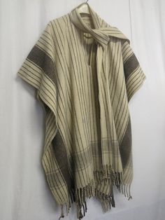 "Wool Fringe Poncho/Cape Stylin' to the Max! Look at the attached scarf What a beauty! This is  Wonderful...Highest quality... Undyed wool...100%  Excellent condition...Out of an old Hollywood Estate Kinda of a one size deal... Dropped shoulder  41\" x 81\" Guys or Gals https://www.etsy.com/shop/BelindasStyleShop" One Size Wool Poncho Shawl, Traditional Beige Poncho For Winter, One Size Beige Wool Poncho, Beige Wool Poncho One Size, Wool Cape Shawl One Size, Cowboy Poncho, Fringe Poncho, Lace Nightgown, Wool Poncho