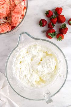 strawberries and cream in a blender next to other ingredients