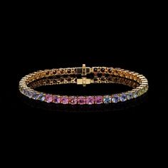 Rainbow sapphire gemstone bracelet 18k gold jewelry / Jewelry for women / Multi Sapphire Jewelry Bracelet for her / Sapphire tennis bracelet STONE DETAILS : ❋ Stone : Rainbow Sapphire ❋ Stone Size : 3.50 MM Approx. (± 0.20 MM) ❋ Stone Shape : Round Cut ❋ Stone Weight : 8.910 Cts. Approx. ❋ Stone Type : Natural METAL DETAILS : ❋ Metal Purity : Solid 18K Gold  ❋ Metal Color : Yellow Gold ❋ Bracelet Length : 6.50 Inches Approx. ❋ Gross Weight : 10.130 Gms. Approx. ❋ Gold Net Weight : 8.347 Gms. App Sapphire Gemstone Bracelet Jewelry, 14k Gold Gemstone Tennis Bracelet In Fine Jewelry Style, Sapphire Gemstone Bracelet, Fine Jewelry Sapphire Tennis Bracelet With 17 Jewels, Yellow Gold Tennis Bracelet With Gemstones For Wedding, Sapphire Tennis Bracelet Fine Jewelry Gift, Gold Sapphire Bracelet In Fine Jewelry Style, Yellow Gold Gemstone Tennis Bracelet For Wedding, Yellow Gold Jeweled Round Bracelets