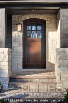 the front door of a house with steps leading up to it