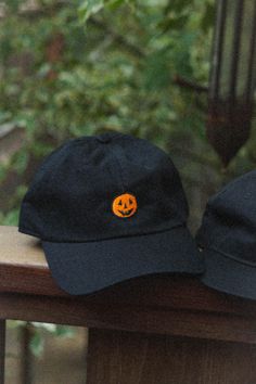 Inspired by the simple pumpkin designs of 90's Halloween info: 6 panel baseball cap (Dad Hat), adjustable sizing Halloween Snapback Baseball Cap, Halloween Adjustable Snapback Baseball Cap, Black Six-panel Fall Hat, Casual Halloween Cap, Adjustable Halloween Hats For Streetwear, Black Snapback Cap For Halloween, Casual Halloween Trucker Hat, Casual Halloween Trucker Hat Baseball Cap, Casual Halloween Baseball Cap