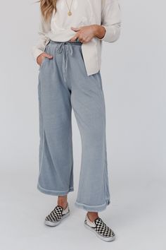 comfy and cozy all in one! our Cropped length leg lounge pant with drawstring waist and pockets will be your closet fave for pairing with graphic tees for school pick up or running errands! Comfy mineral washed sweatpant fabric Relaxed and loose wide leg silhouette High rise elastic drawstring waist Cute piping detail down the sides Curved hem with continued piping along the bottom *This colorway is the cropped length version, we also have a full length and petite length to fit every height! *Du Wide Leg Comfy Pants, Modest Pants, Teacher Fits, Hawaii Summer, Church Fits, Wardrobe Makeover, Fall Capsule Wardrobe, Wide Leg Cropped Pants, Comfy Pants