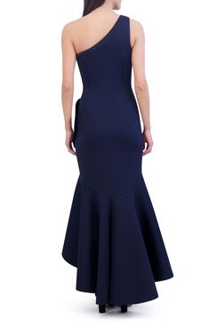 Feel like the life of the party in this stunning one-shoulder gown featuring a side-tuck detail and a boldly ruffled skirt. 40" front length; 60" back length (size 8) Hidden side-zip closure One-shoulder neck Partially lined 90% polyester, 10% spandex Dry clean Imported Ruffled One Shoulder Evening Dress For Prom, One-shoulder Ruffled Evening Dress For Formal Events, One-shoulder Ruffled Evening Dress For Gala, One Shoulder Ruffled Evening Dress For Formal Events, One Shoulder Evening Dress With Ruffled Skirt, One Shoulder Ruffled Skirt Evening Dress, Formal One Shoulder Ruffle Dress For Prom, Formal One Shoulder Dress With Ruffles For Prom, One Shoulder Ruffled Evening Dress For Cocktail