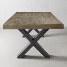 a wooden table with metal legs and a square shaped top, on a white background