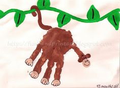 a child's drawing of a monkey hanging from a tree branch with leaves on it