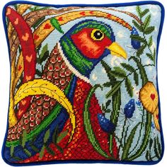 a decorative pillow with a colorful bird on it