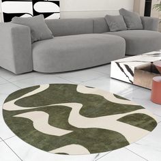 a modern living room with grey couches and green rugs on the white floor