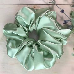 This Mint Green polyester scrunchie is shiny and silky to the touch. All scrunchies are handmade by me and finished with an invisible ladder stitch. This means you will not see any top stitching. Love and care go into each scrunchie so that they are made with exceptional quality and to help you look and feel beautiful. DETAILS *  Fabric Content: 100% Polyester *  Fabric Type: Shiny Satin *  Color: Mint Green *  Handmade, finished with an invisible ladder stitch rather than a top stitch *  Size: Green Scrunchie, Tie Hair, Scrunchie Hair, Ladder Stitch, Satin Color, Feel Beautiful, Green Satin, Big Hair, Hair Tie