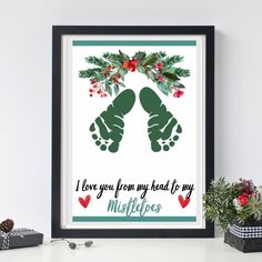 a christmas card with two hands holding holly leaves and the words i love you from my head to my heart